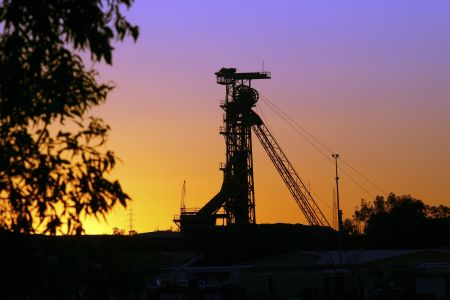 Mining hoist at Olympic Dam with a colourful sunset